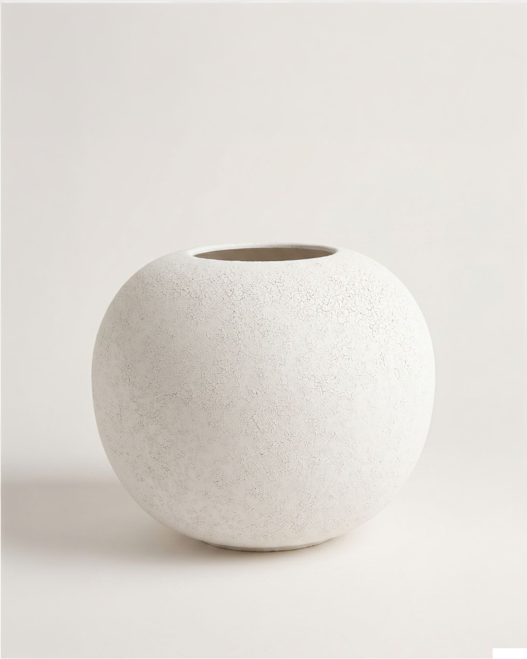 White textured vase on a light gray background