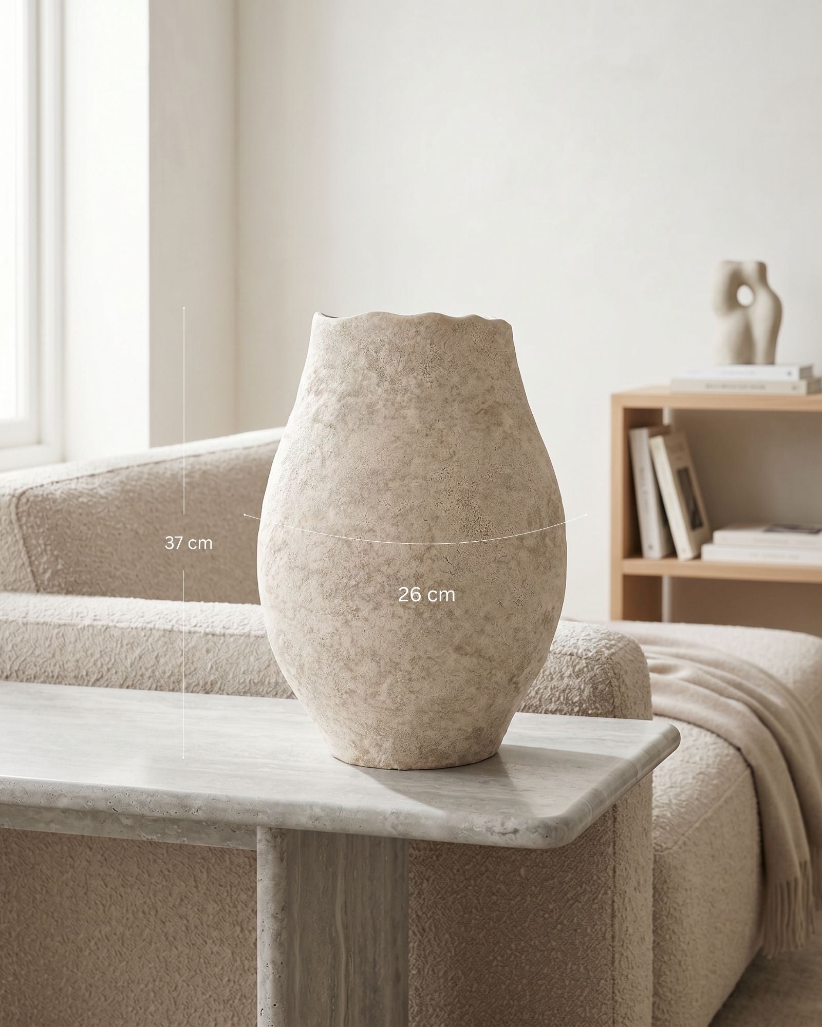 Beige vase on a marble table with dimensions indicated, in a minimalistic room setting.