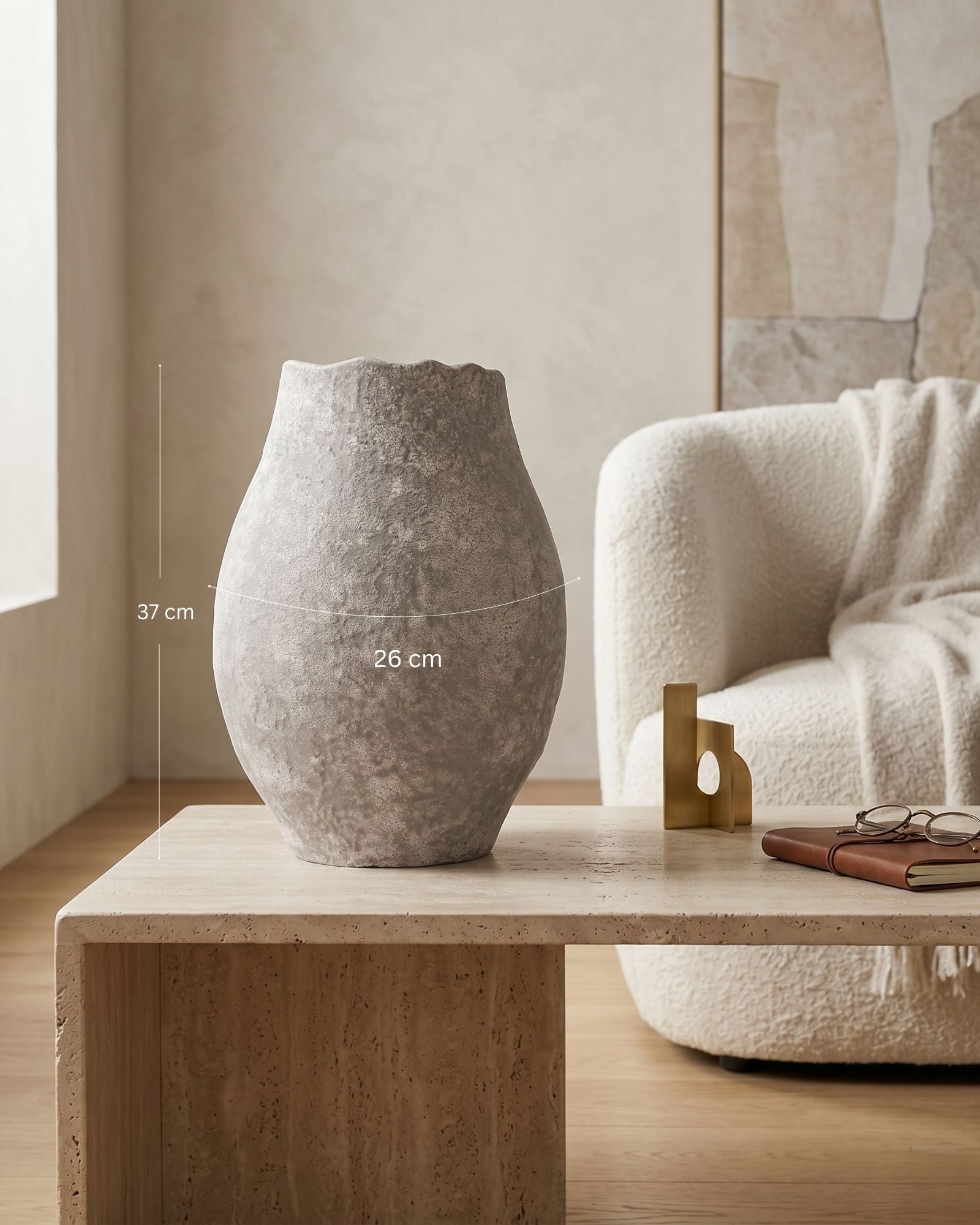 Gray textured vase on a wooden table with dimensions indicated, in a room setting.