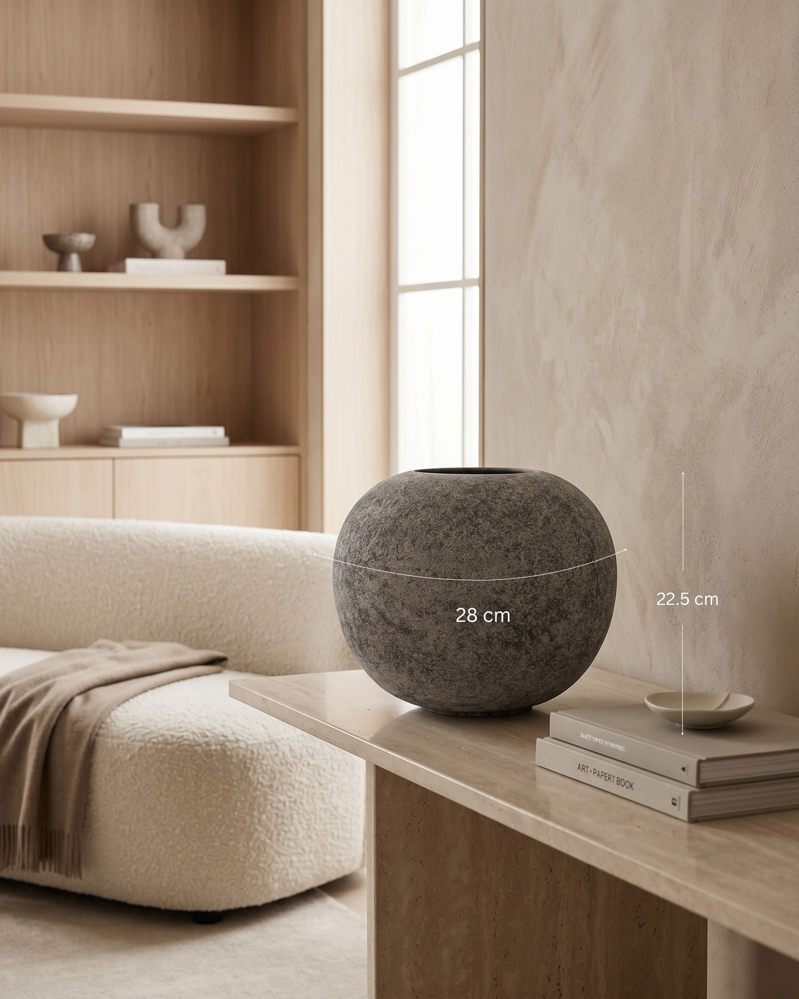 Decorative stone bowl on a table with a neutral color palette
