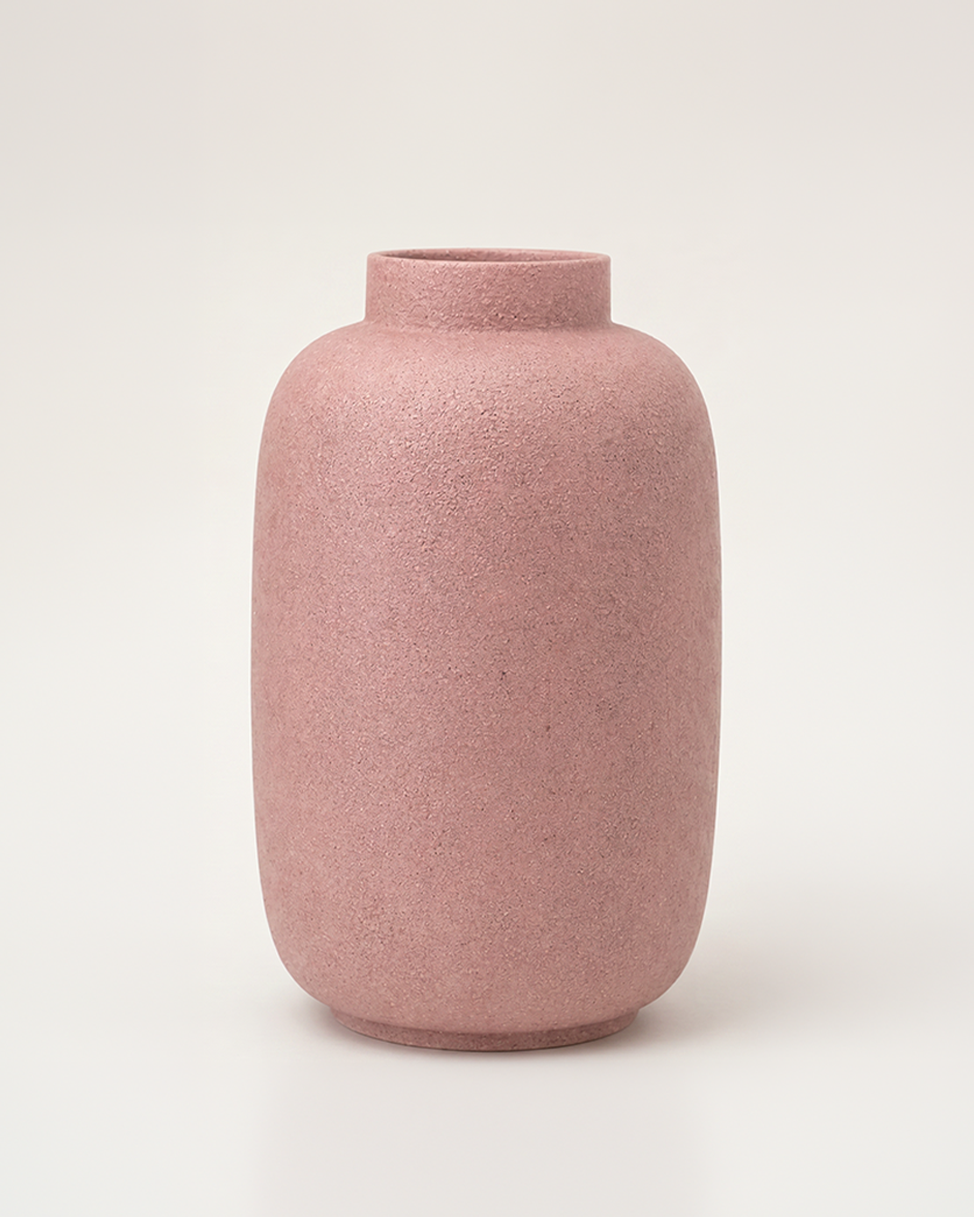 Pink textured vase on a light beige background