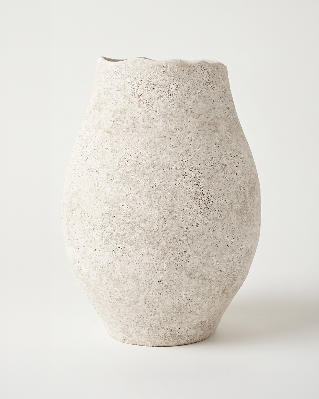 Textured beige vase on a white background