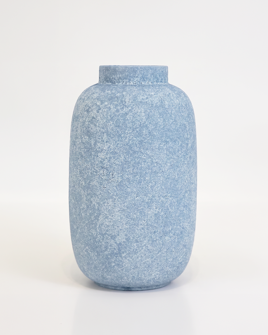 Blue textured vase on a white background
