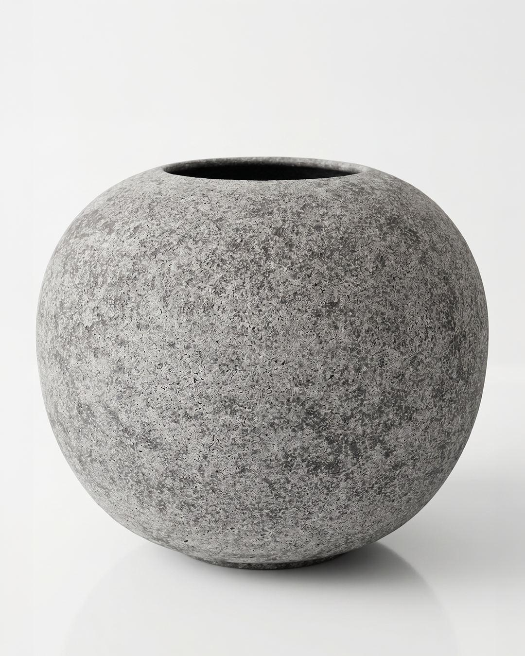 Gray stone-like textured vase on a white background