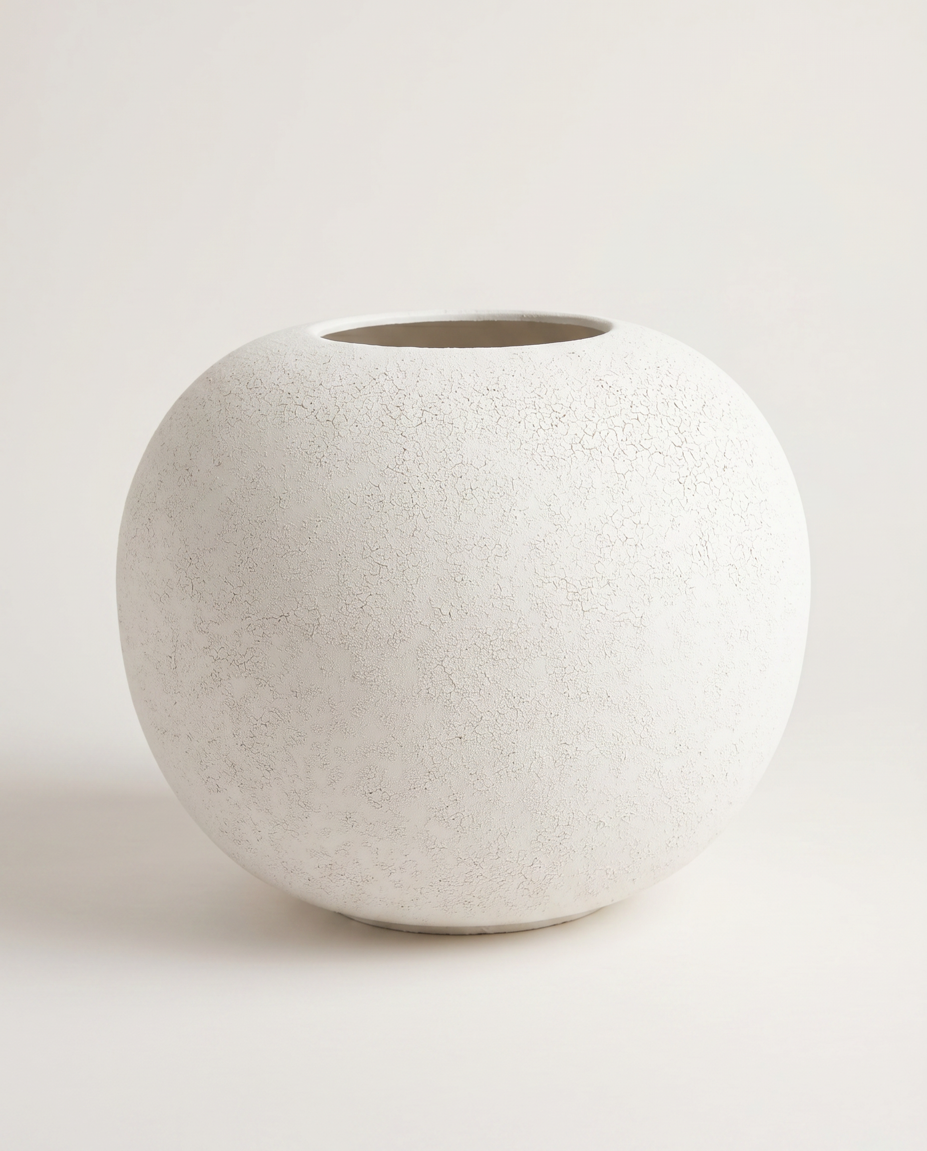 White textured vase on a light gray background