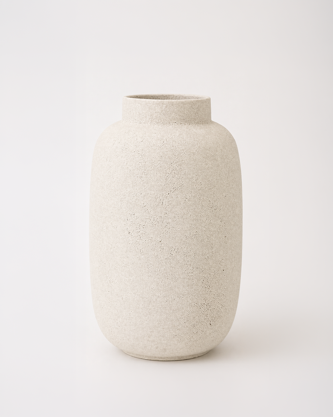 Beige ceramic vase on a white background
