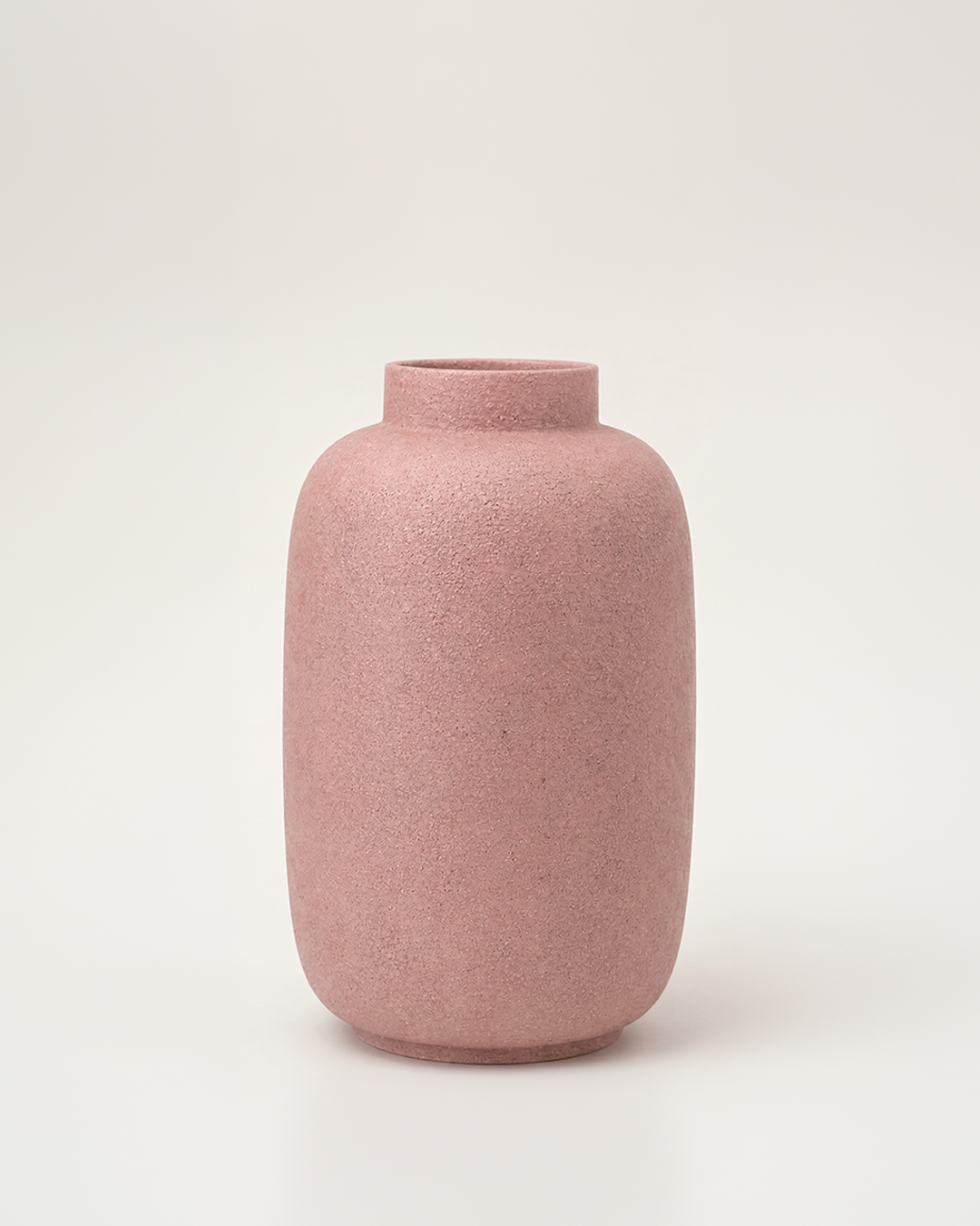 Pink textured vase on a light gray background