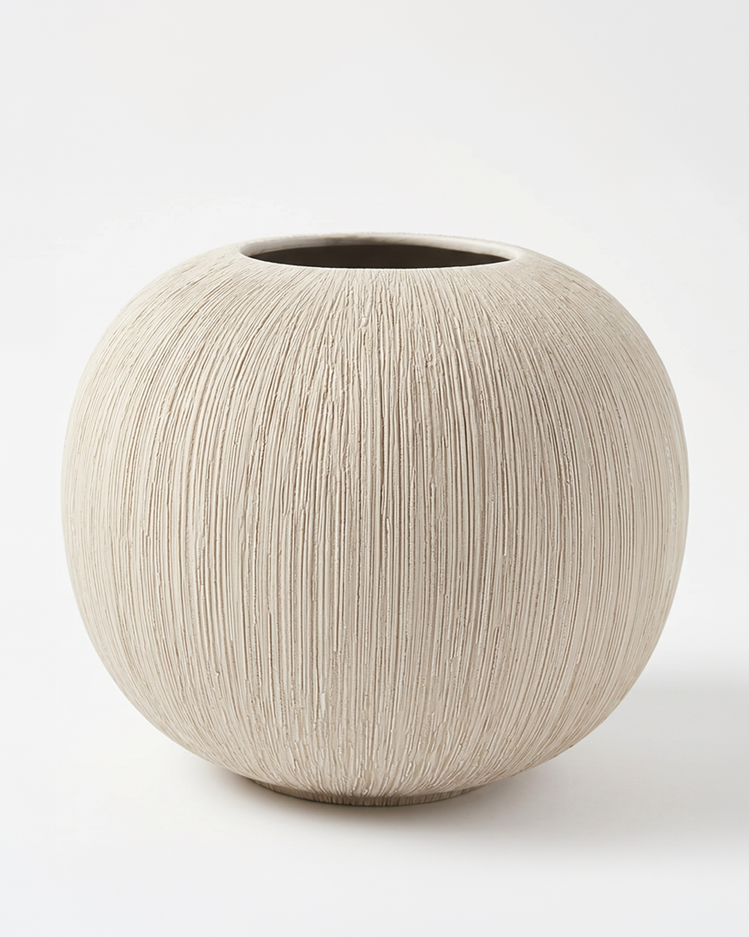 Round beige ceramic vase on a white background