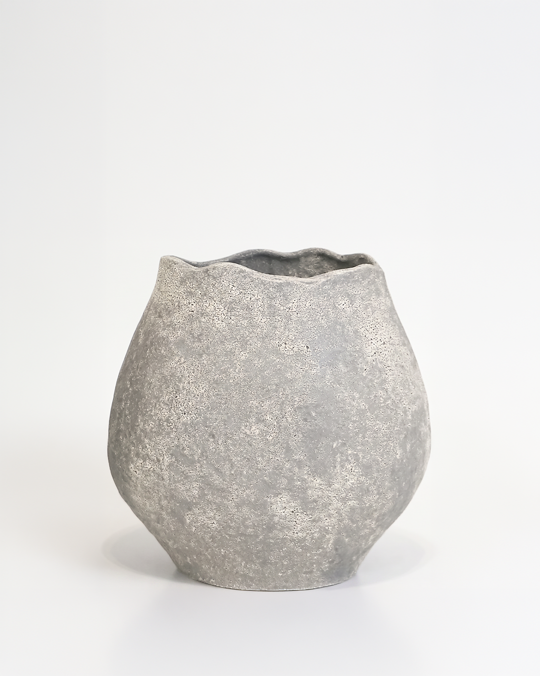 Gray textured ceramic vase on a white background