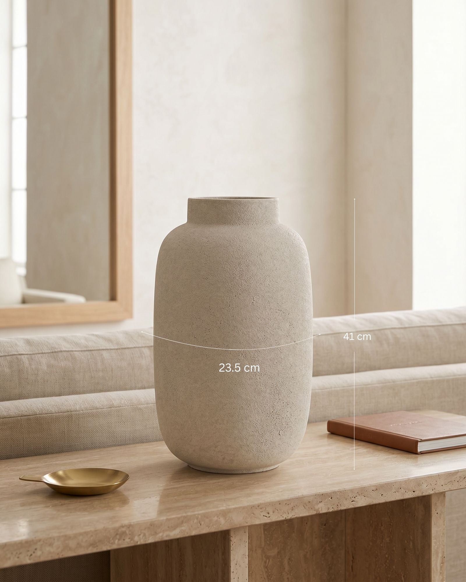 Beige ceramic vase on a wooden surface with a blurred background