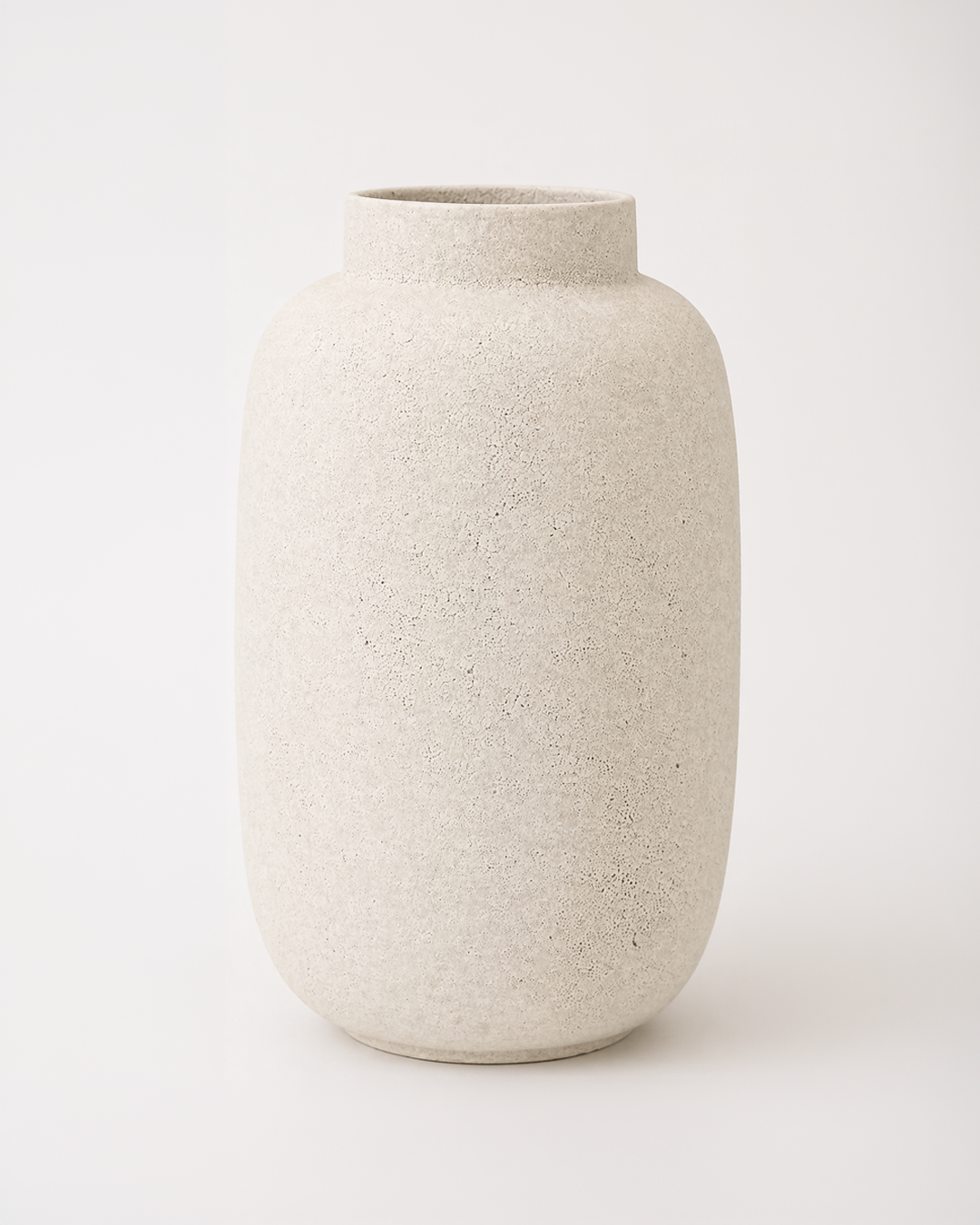 Beige ceramic vase on a white background