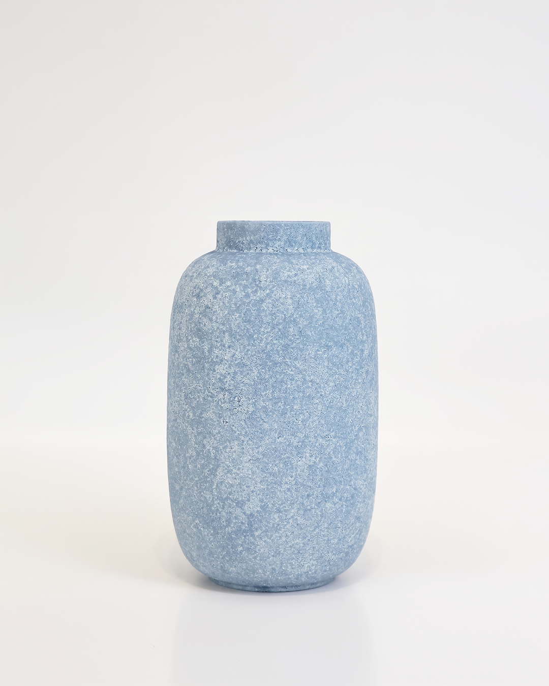 Blue textured vase on a white background